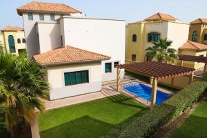 a view of the backyard of a villa at The Grove Resort Bahrain in Manama