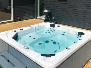 a jacuzzi bath tub in a room with at 14 person holiday home in V ggerl se in Marielyst