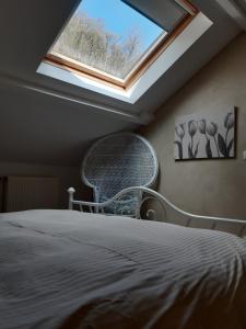 Łóżko lub łóżka w pokoju w obiekcie La Tulipe