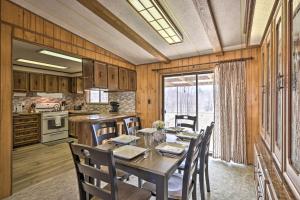 a kitchen and dining room with a table and chairs at Richfield Home with Views about 13 Miles to Natl Park in Richfield