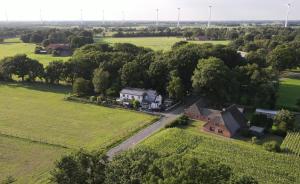 an aerial view of a house in a field at Landhaus Galke in Hude