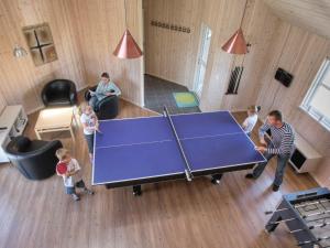 a group of children standing around a ping pong table at 16 person holiday home in Bagenkop in Bagenkop
