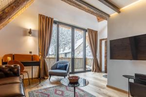 a living room with a large window at Das Fort Boutique in Râşnov