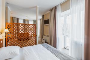Кровать или кровати в номере Отель Ампаро