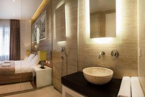 En eller flere senger på et rom på Eden Garden Suites