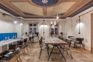 a dining room with tables and chairs and a ceiling at Das Fort Boutique in Râşnov