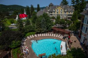 an overhead view of a swimming pool at a resort at La Tour des Voyageurs II in Mont-Tremblant