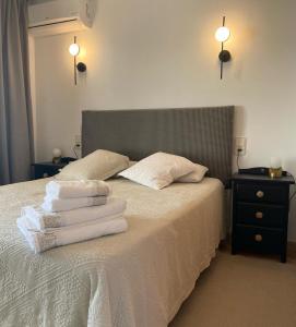 Ein Bett oder Betten in einem Zimmer der Unterkunft Duplex Torre Almadrava