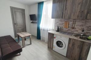 a kitchen with a washing machine in a kitchen at Yerevan Studio in Yerevan