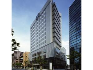 a rendering of a tall building in a city at R&B HOTEL HACHIOJI - Vacation STAY 13872v in Hachioji