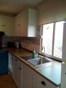 Kuchyň nebo kuchyňský kout v ubytování Casa o Furco