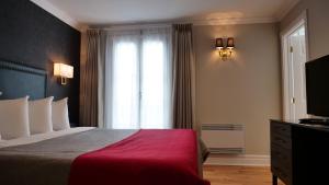 Кровать или кровати в номере Hotel Bonaparte