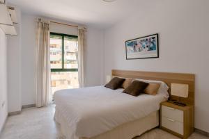 Posteľ alebo postele v izbe v ubytovaní Apartamento Residencial Bajondillo