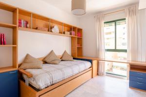 Posteľ alebo postele v izbe v ubytovaní Apartamento Residencial Bajondillo