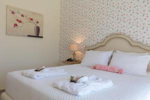 Un ou plusieurs lits dans un hébergement de l'établissement Elafonisos Resort