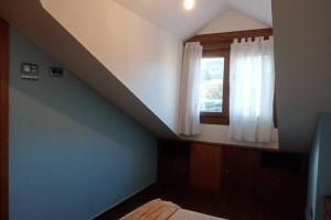 A bed or beds in a room at La casa de Aldán entre el mar y el bosque