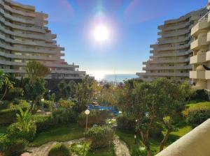 a view from the balcony of a resort with buildings at Benalbeach, Bonito apartamento 2 dormitorios in Benalmádena