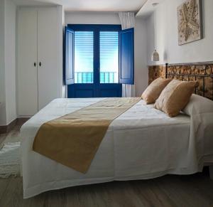 Posteľ alebo postele v izbe v ubytovaní Knysna Boutique Rooms