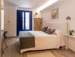 Posteľ alebo postele v izbe v ubytovaní Knysna Boutique Rooms