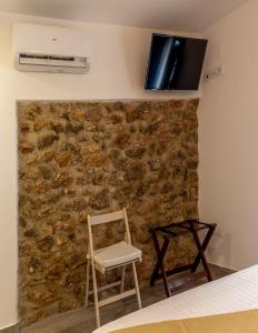 Televízia a/alebo spoločenská miestnosť v ubytovaní Knysna Boutique Rooms
