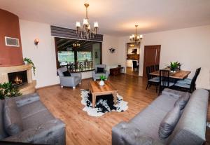 a living room with a couch and a table at MyHomeSapanca in Sapanca