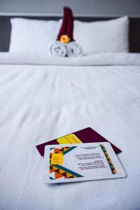 Katil atau katil-katil dalam bilik di HOTEL PANTES SIMPANG LIMA SEMARANG