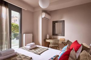 Posteľ alebo postele v izbe v ubytovaní Elaia Luxury Condo Glyfada + 37 fotografií