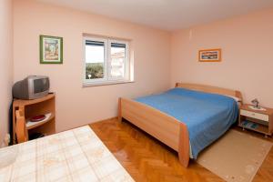 Posteľ alebo postele v izbe v ubytovaní Apartments Petani