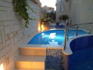 The swimming pool at or close to Angelica Studios and Apartments