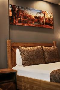 A bed or beds in a room at Zengin City Hotel