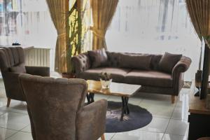 A seating area at Zengin City Hotel