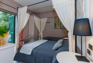 Postel nebo postele na pokoji v ubytování Hotel Monti