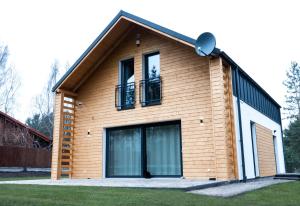 a house with a window on top of it at Home by the sea SASINO in Sasino