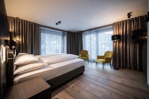 Postel nebo postele na pokoji v ubytování Hotel Plan Murin + 37 fotografií