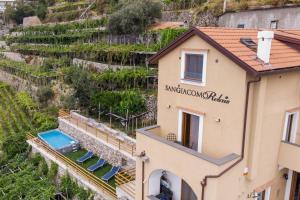 an aerial view of a house with a vineyard at San Giacomo Relais in Furore