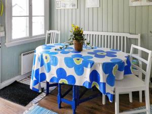 a dining room table with a blue and white table cloth at 6 person holiday home in LYSEKIL in Lysekil