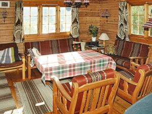 a living room with a bed and a couch at Four-Bedroom Holiday home in Olden 1 in Olden