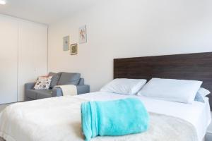 Katil atau katil-katil dalam bilik di Apartamento incrível Pueblo 595 +39 gambar