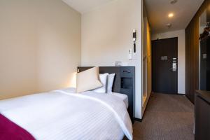 Postel nebo postele na pokoji v ubytování Hotel Shuranza Chiba