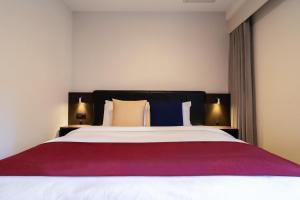 Postel nebo postele na pokoji v ubytování Hotel Shuranza Chiba