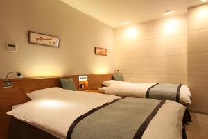 Katil atau katil-katil dalam bilik di My Hotel Ryugu
