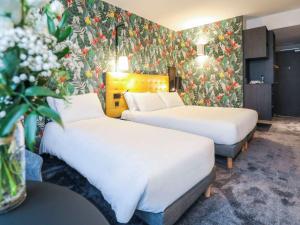 Postel nebo postele na pokoji v ubytování ibis Styles Puteaux Paris La Defense