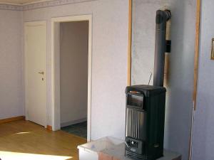 a room with a heater in the corner of a room at 6 person holiday home in H CKSVIK in Håcksvik