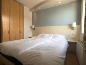 Postel nebo postele na pokoji v ubytování La Playa, Residence Deurloo 53-14