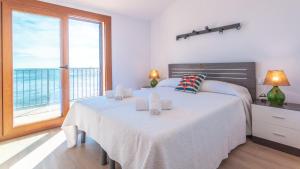 Ένα ή περισσότερα κρεβάτια σε δωμάτιο στο Voramar B