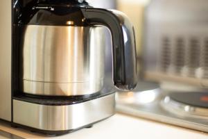 a black and silver coffee pot sitting on a counter at Zum Bergischen Hof in Dormagen