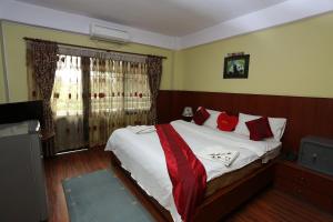 Ein Bett oder Betten in einem Zimmer der Unterkunft New Hotel Panda