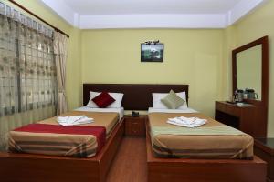 Ein Bett oder Betten in einem Zimmer der Unterkunft New Hotel Panda