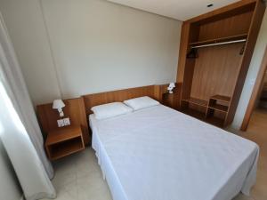 A bed or beds in a room at Salinas Exclusive Resort