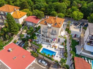 an overhead view of a house with a pool at Villa Vita Apartments in Crikvenica